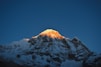 a snow covered mountain with a blue sky in the background