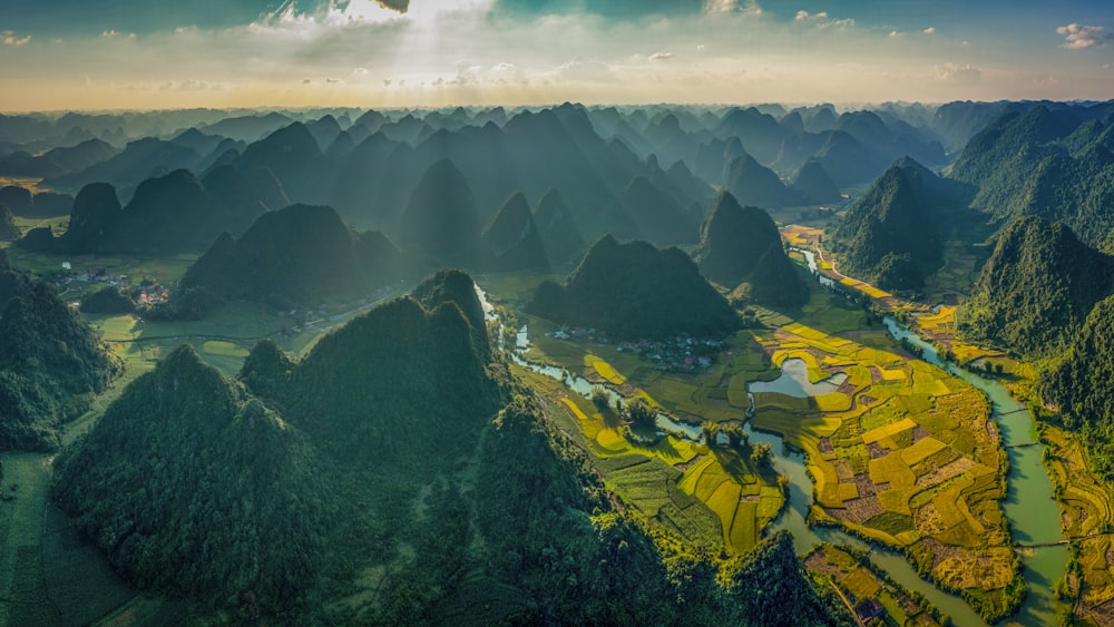 an aerial view of a valley surrounded by mountains