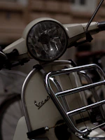 Close-up of a beautifully restored classic Lambretta scooter with gleaming chrome details and vibrant paint.