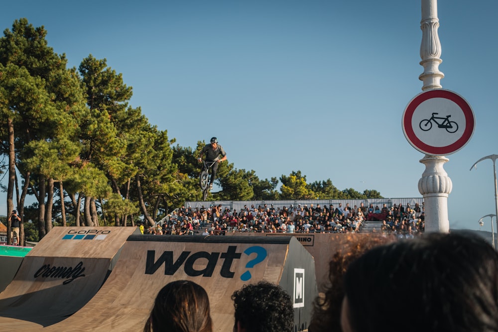 a man riding a skateboard up the side of a ramp