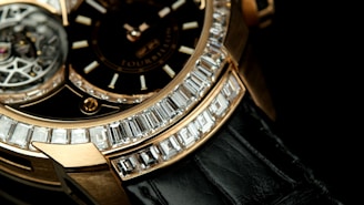 a close up of a watch on a black surface