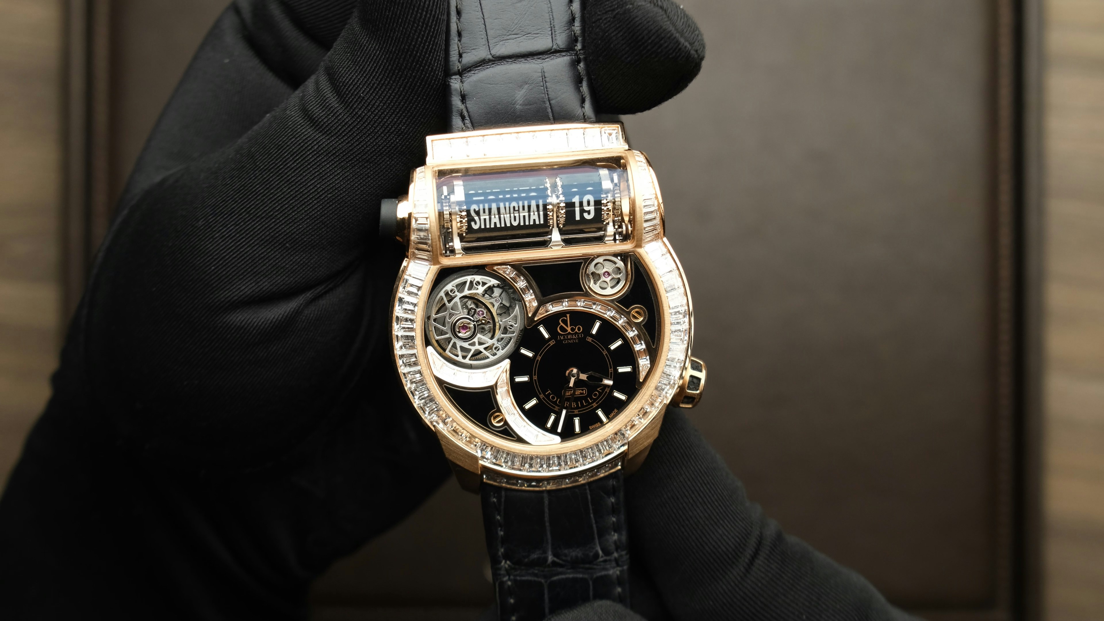 a person holding a watch in their hand, Jacob & Co EPIC SF24 Tourbillon Baguette - Piéce Unique