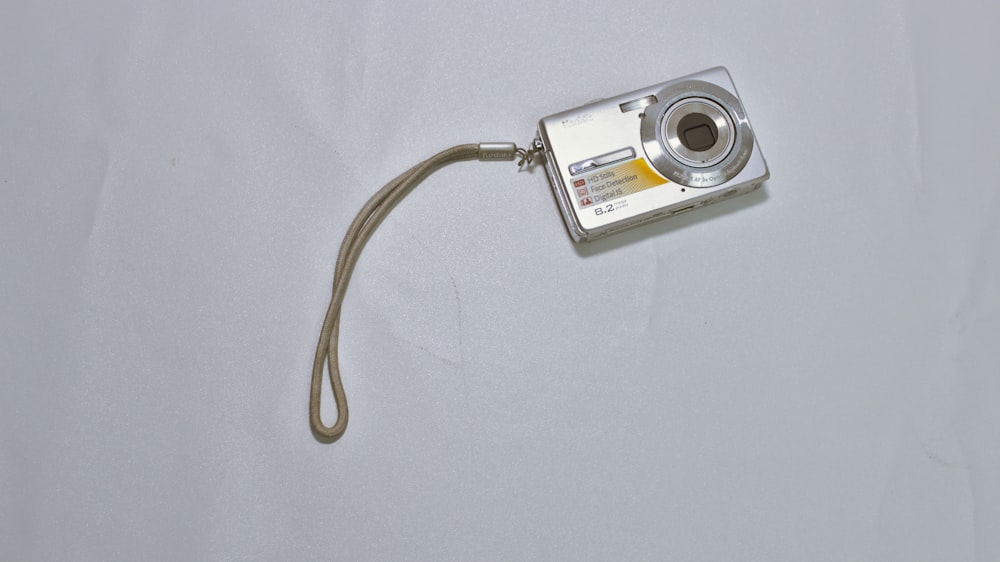 a camera with a cord attached to it
