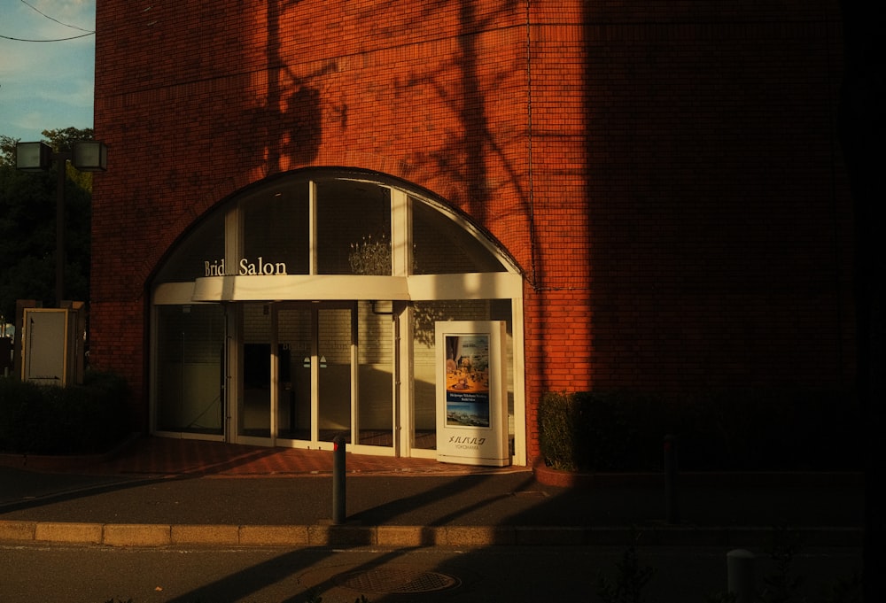 a red brick building with a sign on the front of it