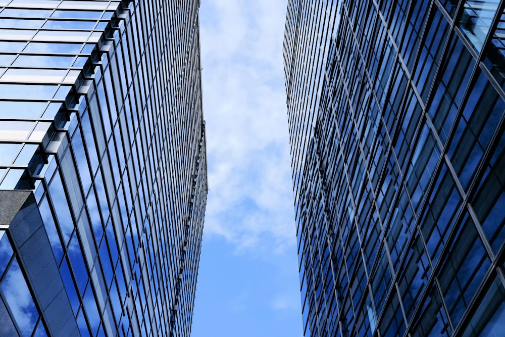 a couple of tall buildings next to each other