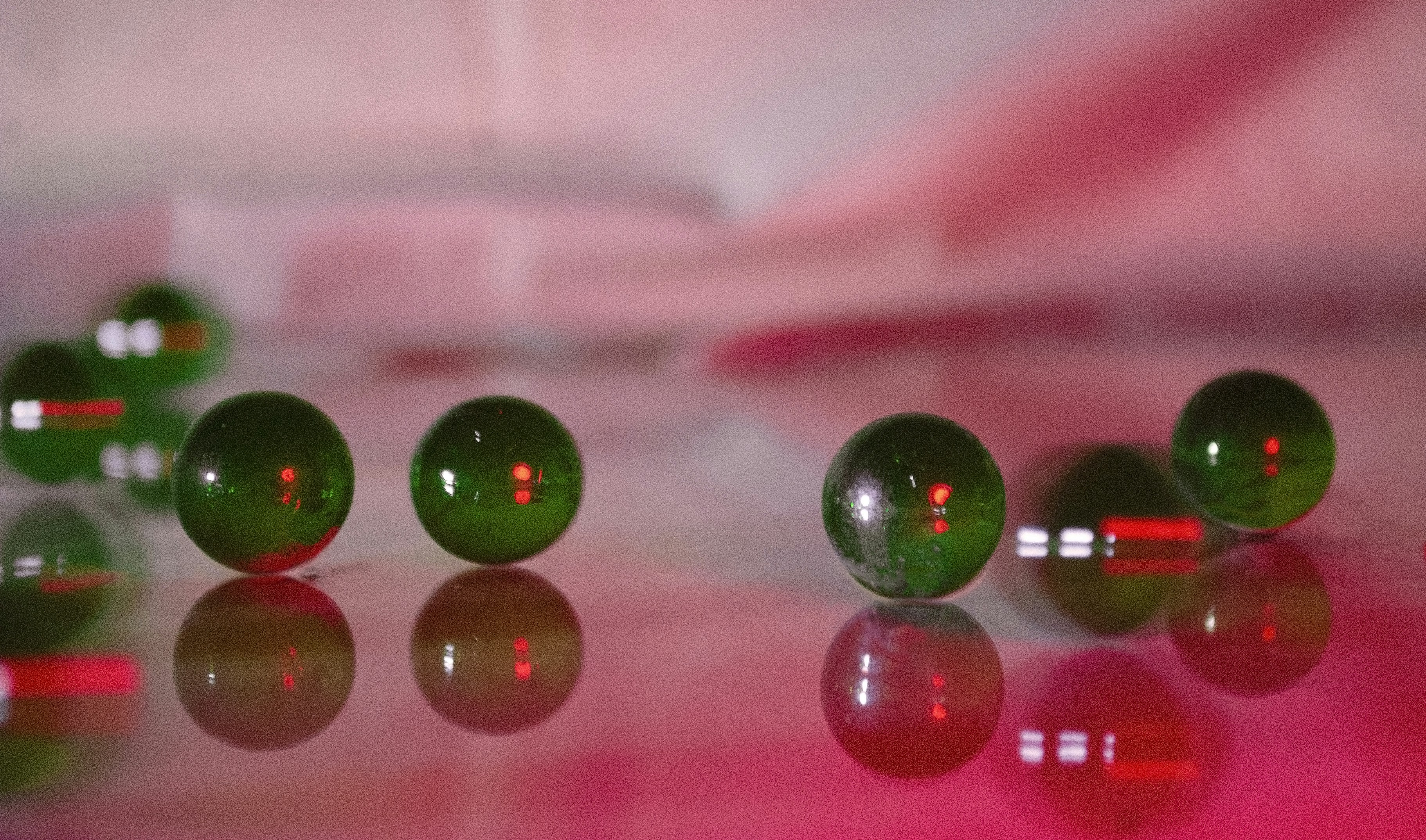 a group of green balls sitting on top of a table
