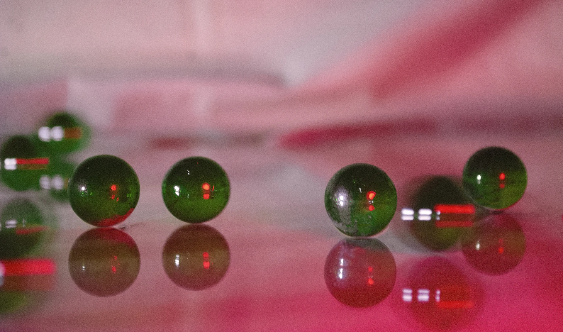 a group of green balls sitting on top of a table
