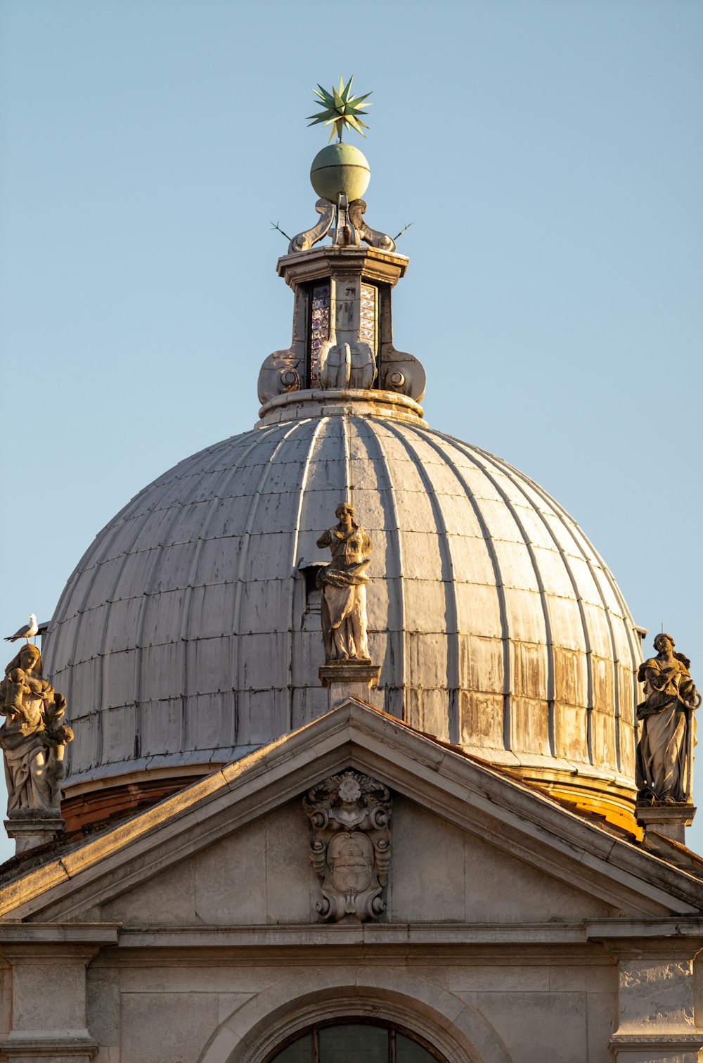 a dome with statues on top of it