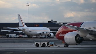 a couple of airplanes that are on a runway