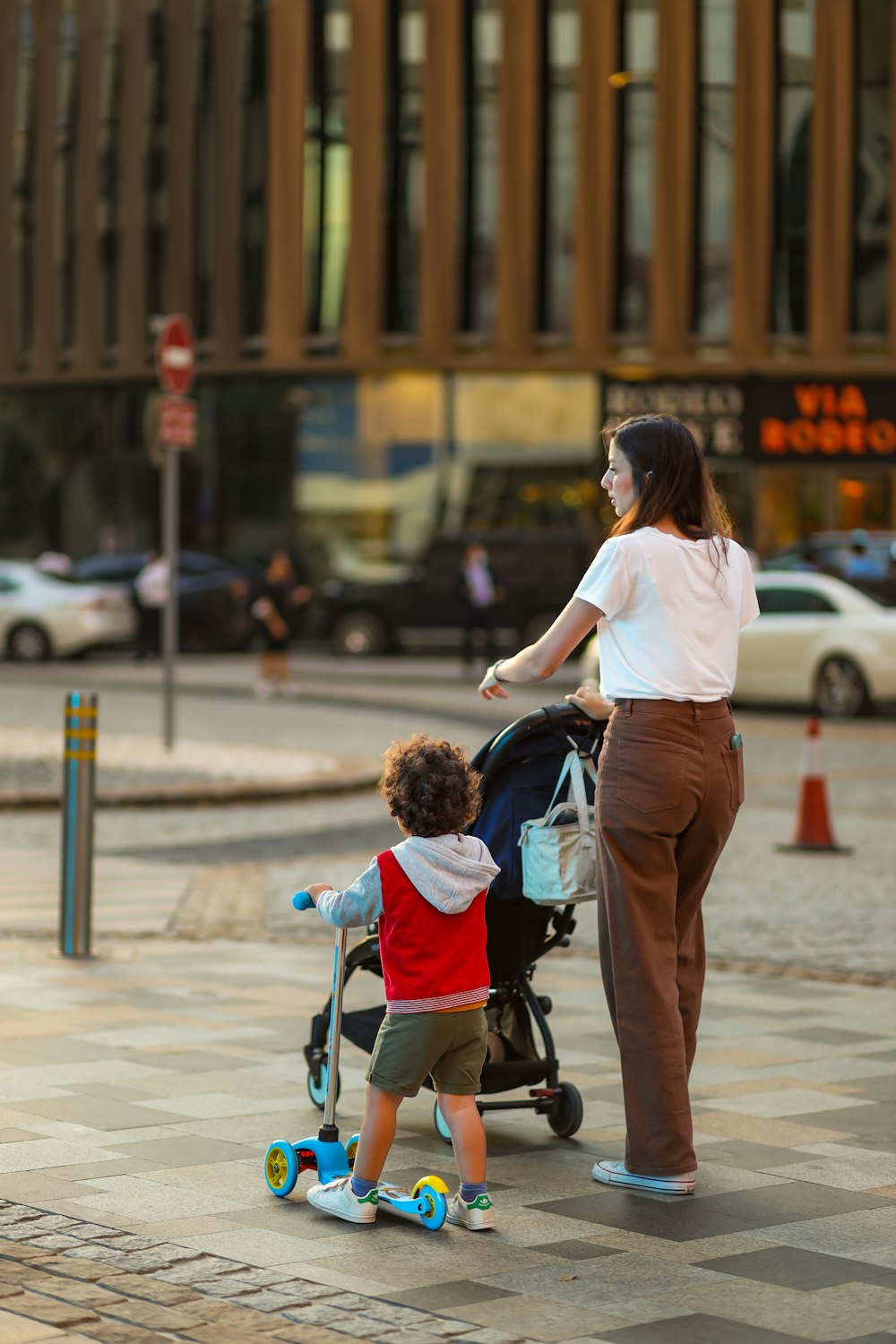 a woman pushing a child in a stroller