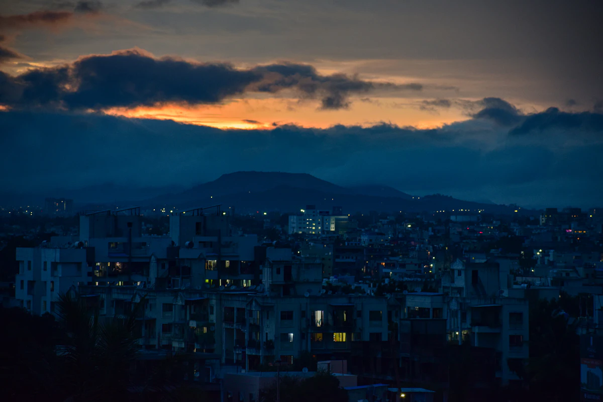 Pune city skyline at night with hills in the background