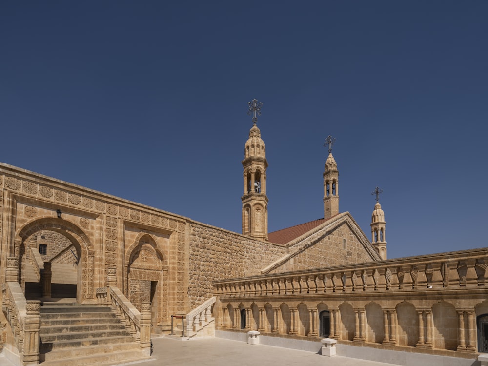 a building with a clock tower and a staircase