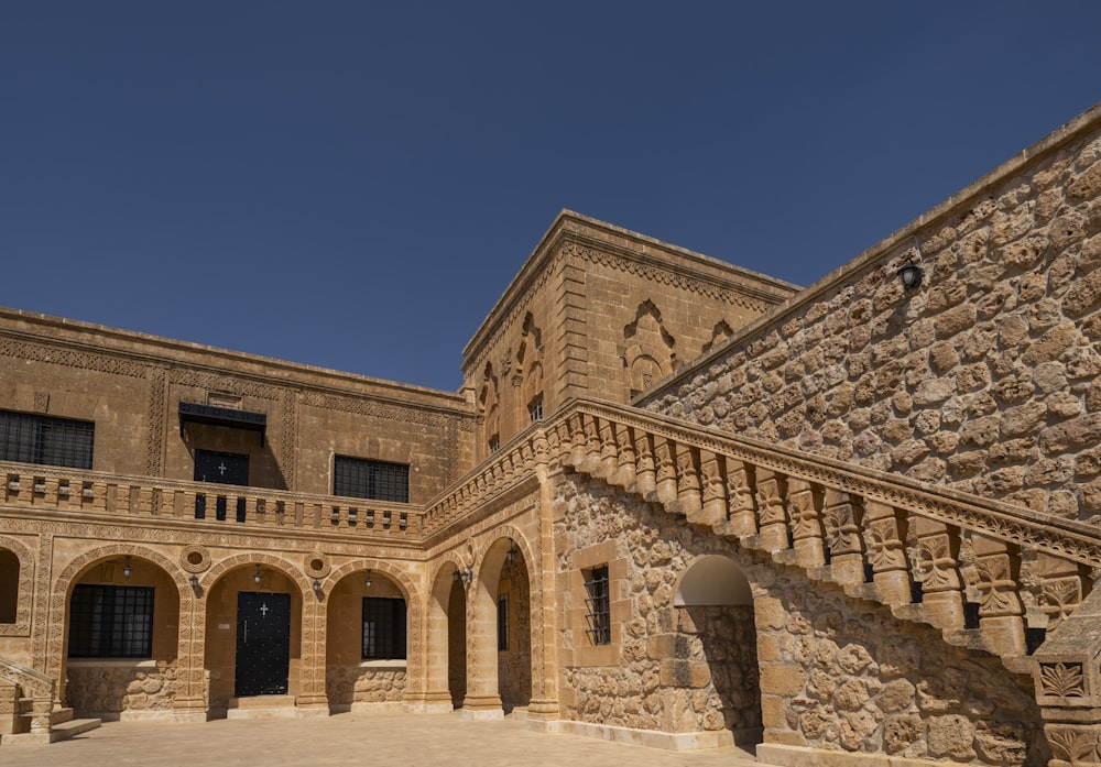 a stone building with a staircase leading up to it