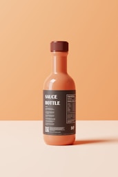 a bottle of sauce sitting on top of a table