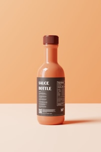 a bottle of sauce sitting on top of a table