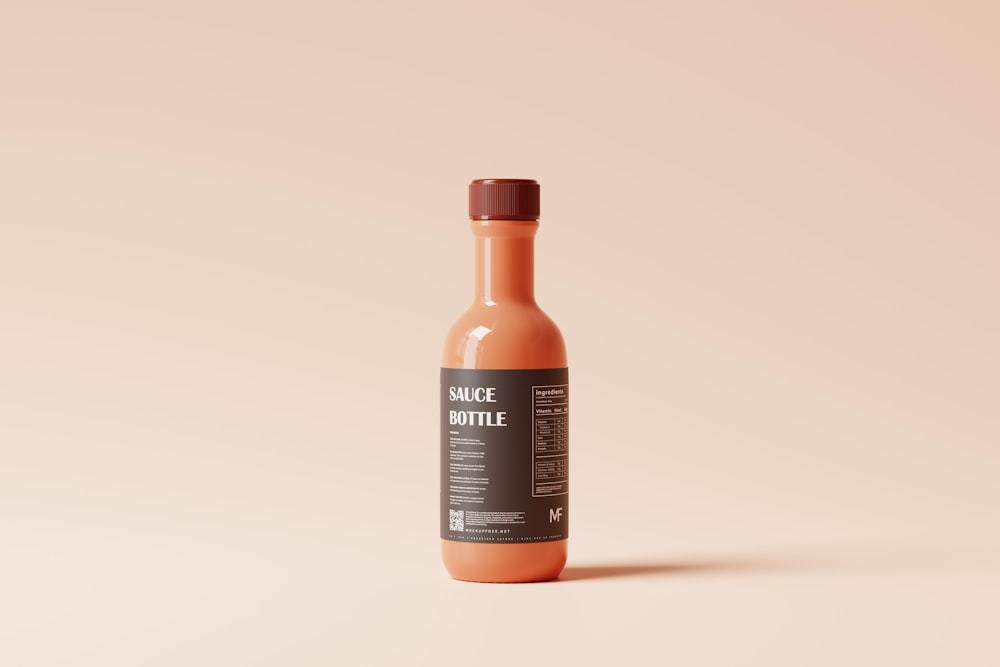 a bottle of sauce sitting on top of a table