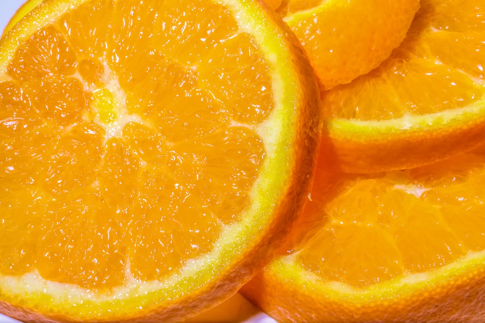 a pile of oranges sitting on top of each other