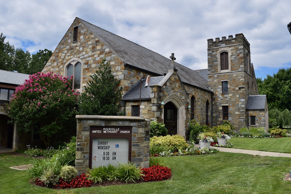 a church with a sign in front of it