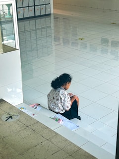 A thoughtful student reviewing legal case notes in a cozy study corner.