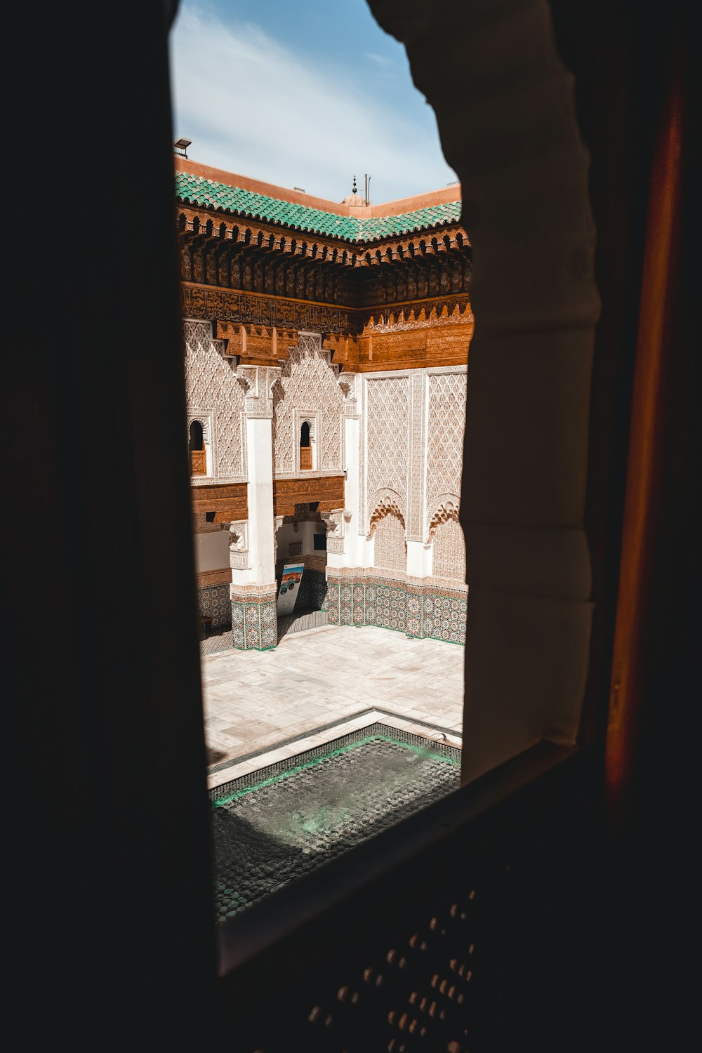 a view of a courtyard through a window