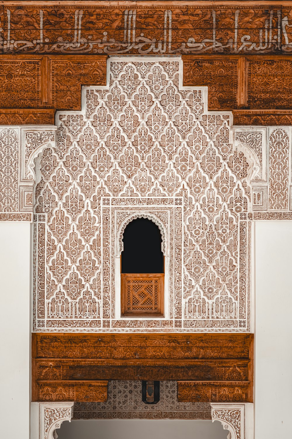 a white and brown building with a wooden door