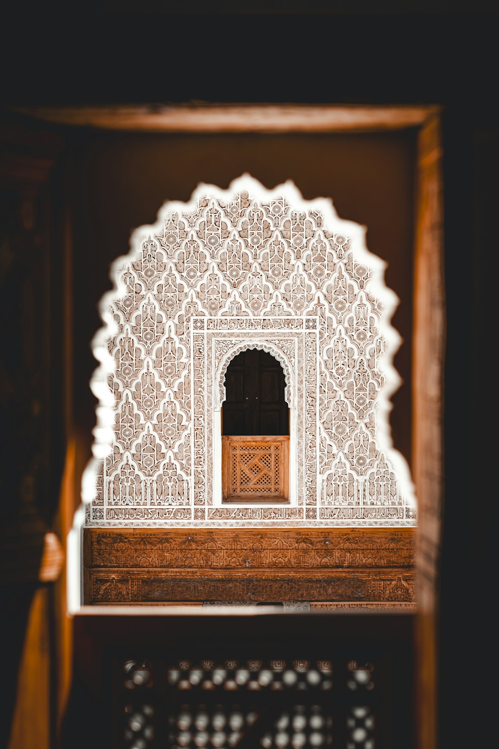 a white and wooden structure with a wooden door