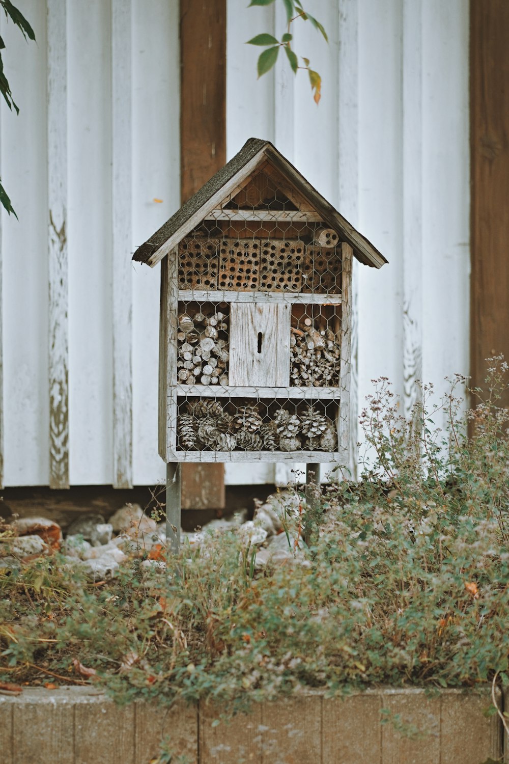 a bird house made out of wood and logs