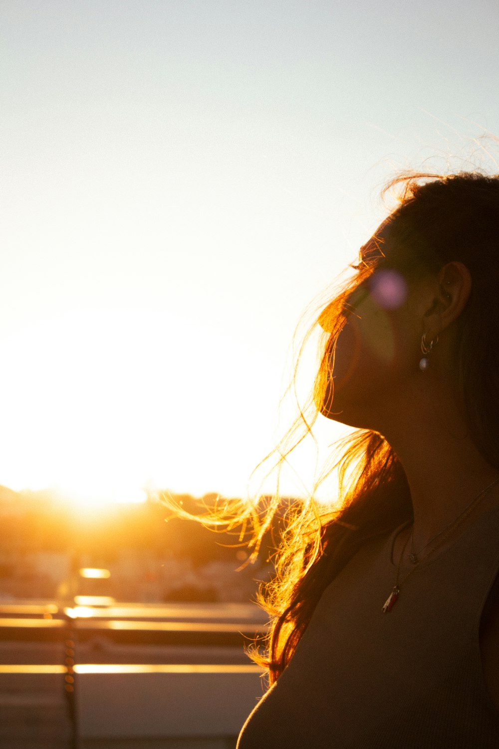 a woman with her hair blowing in the wind