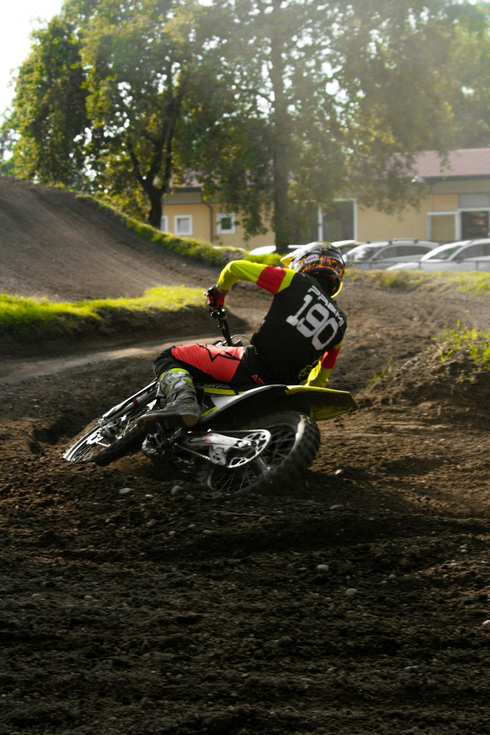 a man riding a dirt bike on top of a dirt field