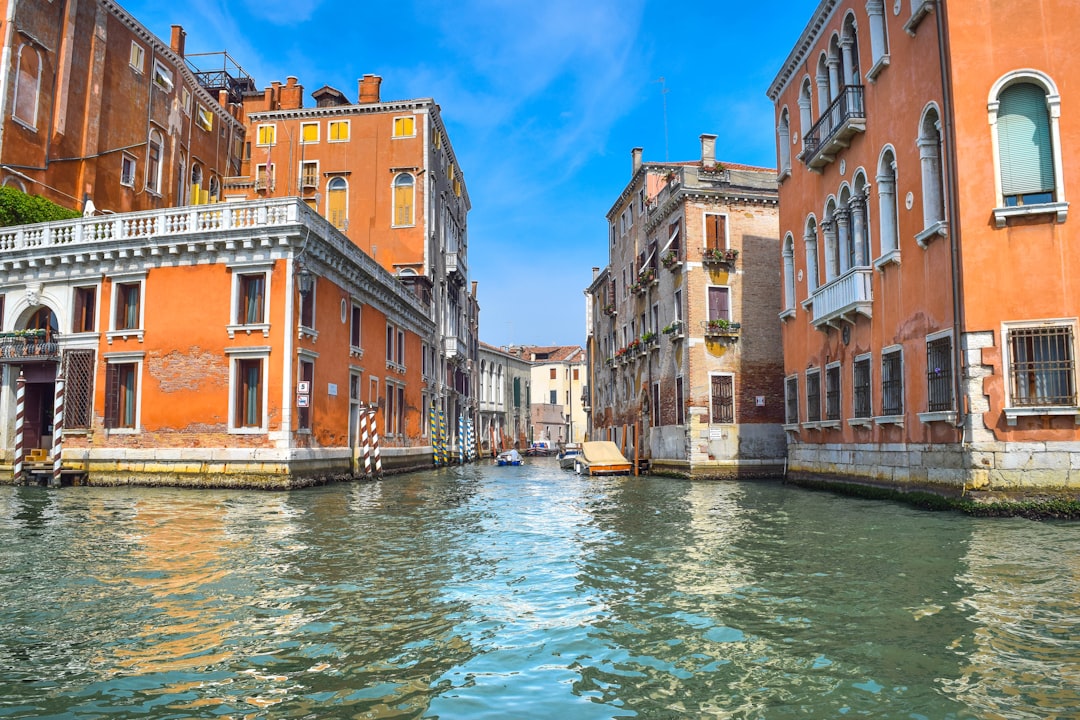 a canal with buildings on both sides of it,