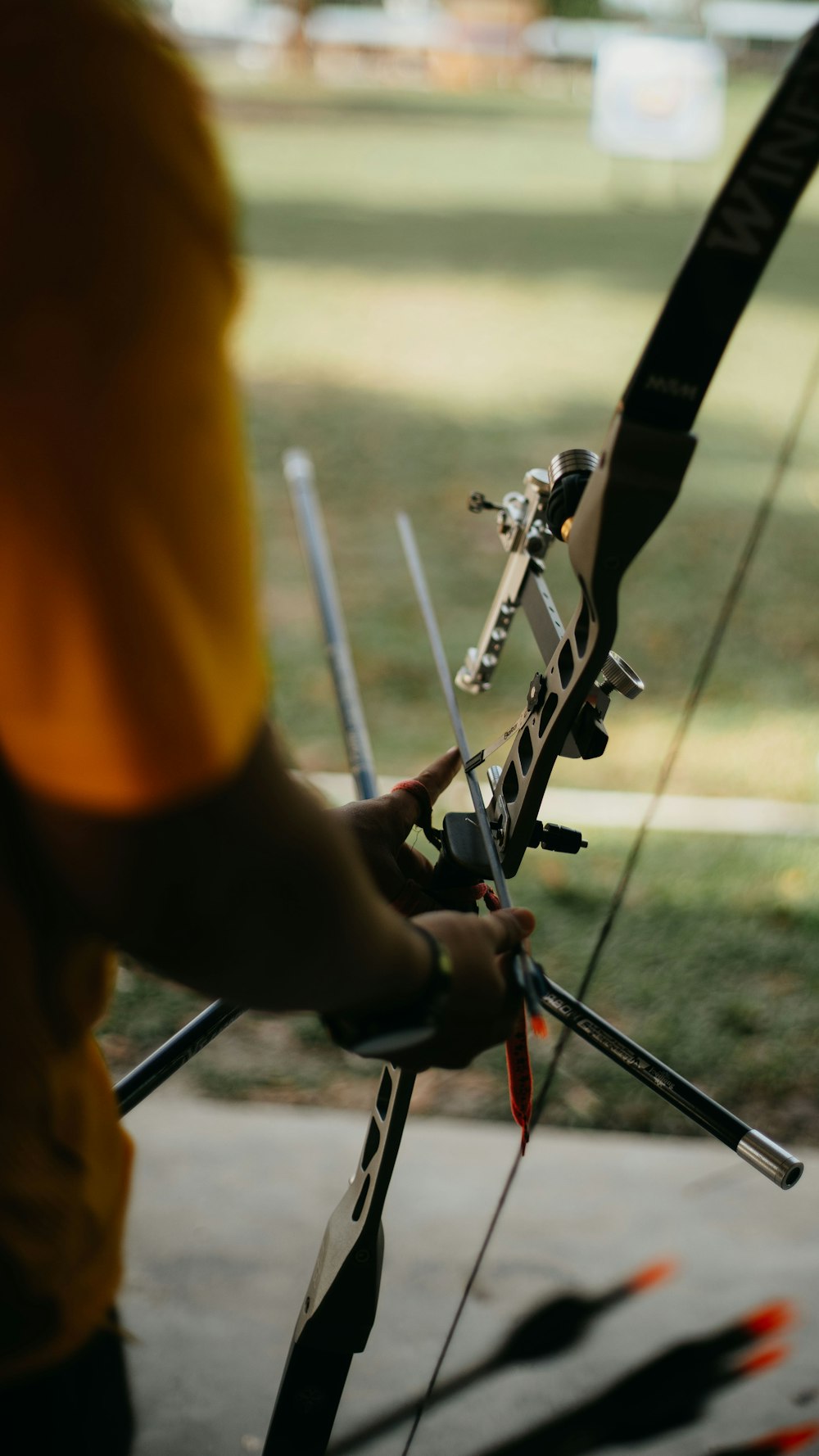 a person holding a bow and arrows in their hands