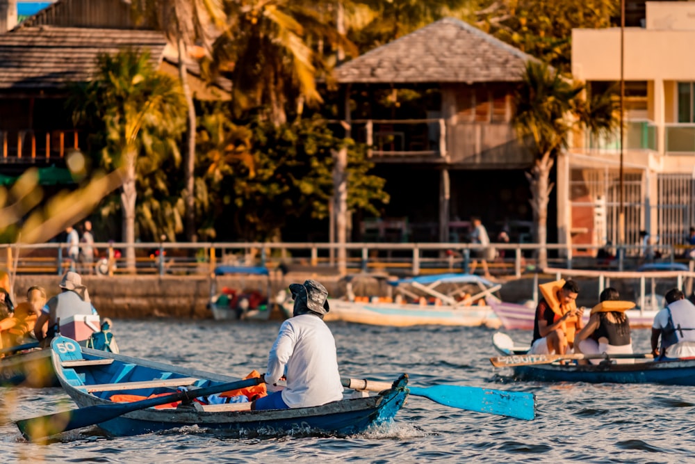 a group of people in small boats on a body of water