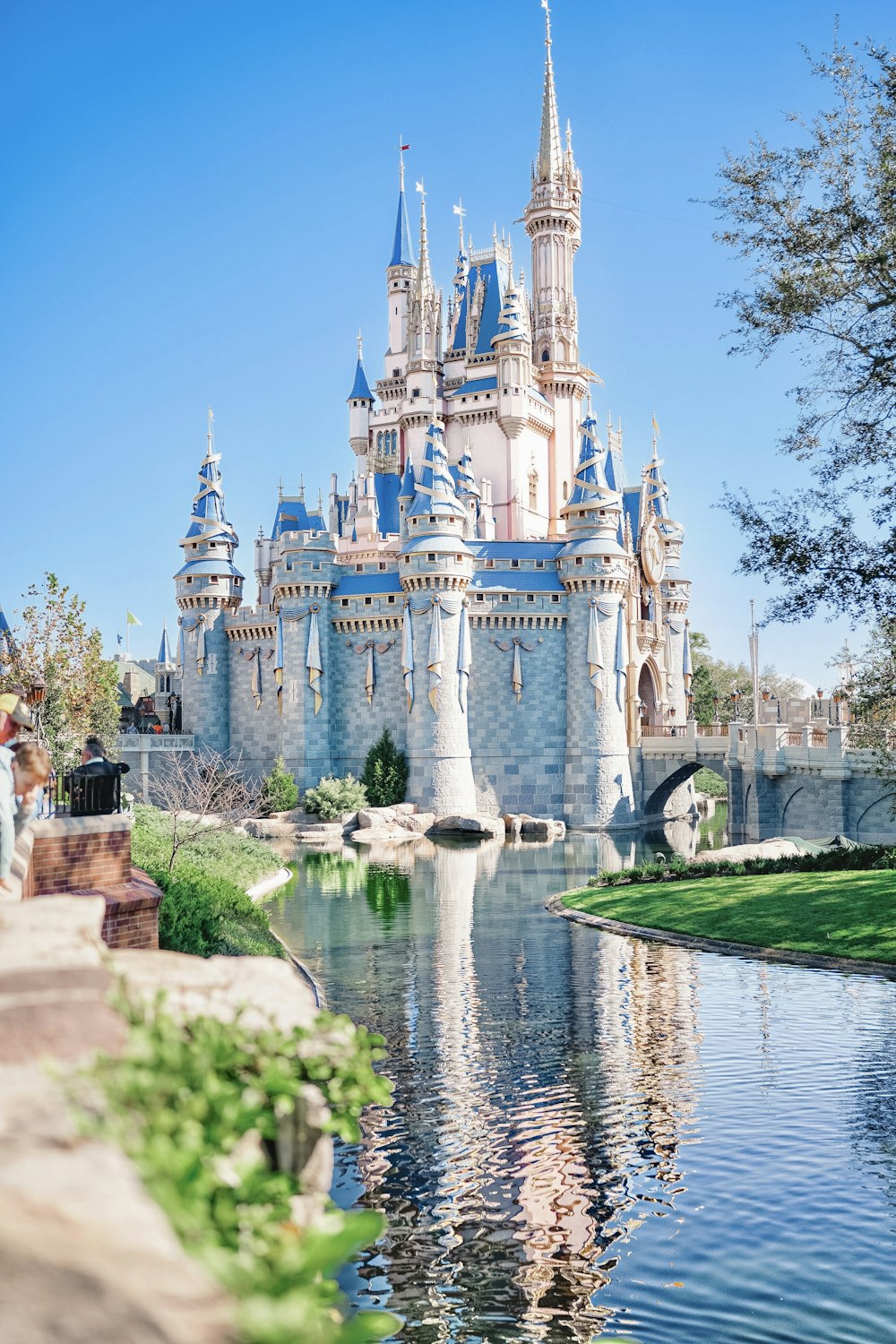 a castle with a pond in front of it