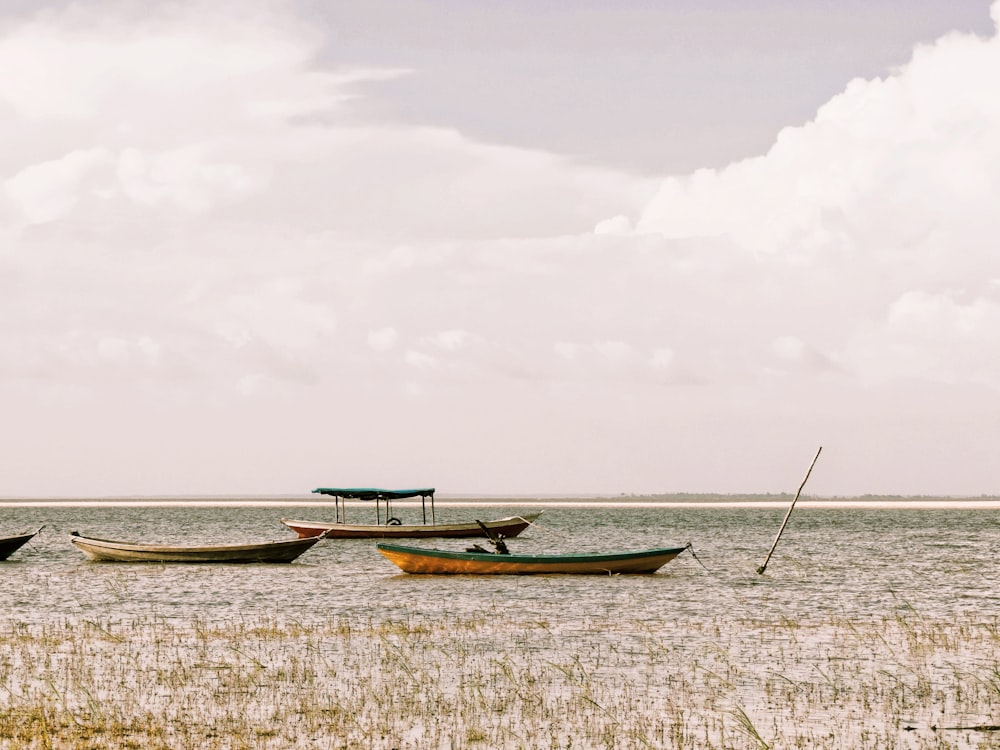 a couple of boats that are sitting in the water