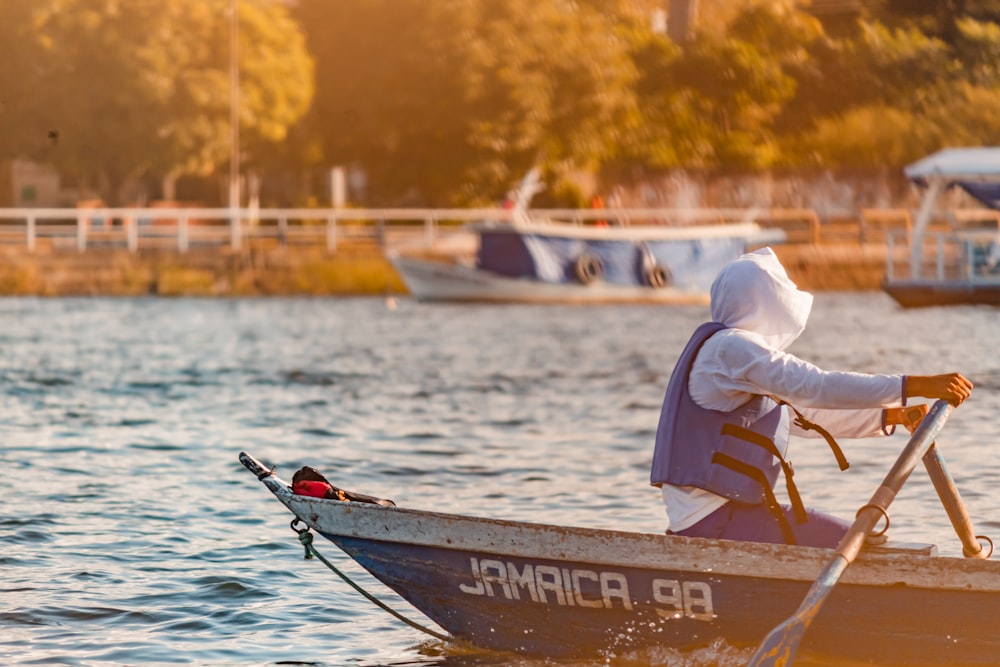 a person in a boat on a body of water