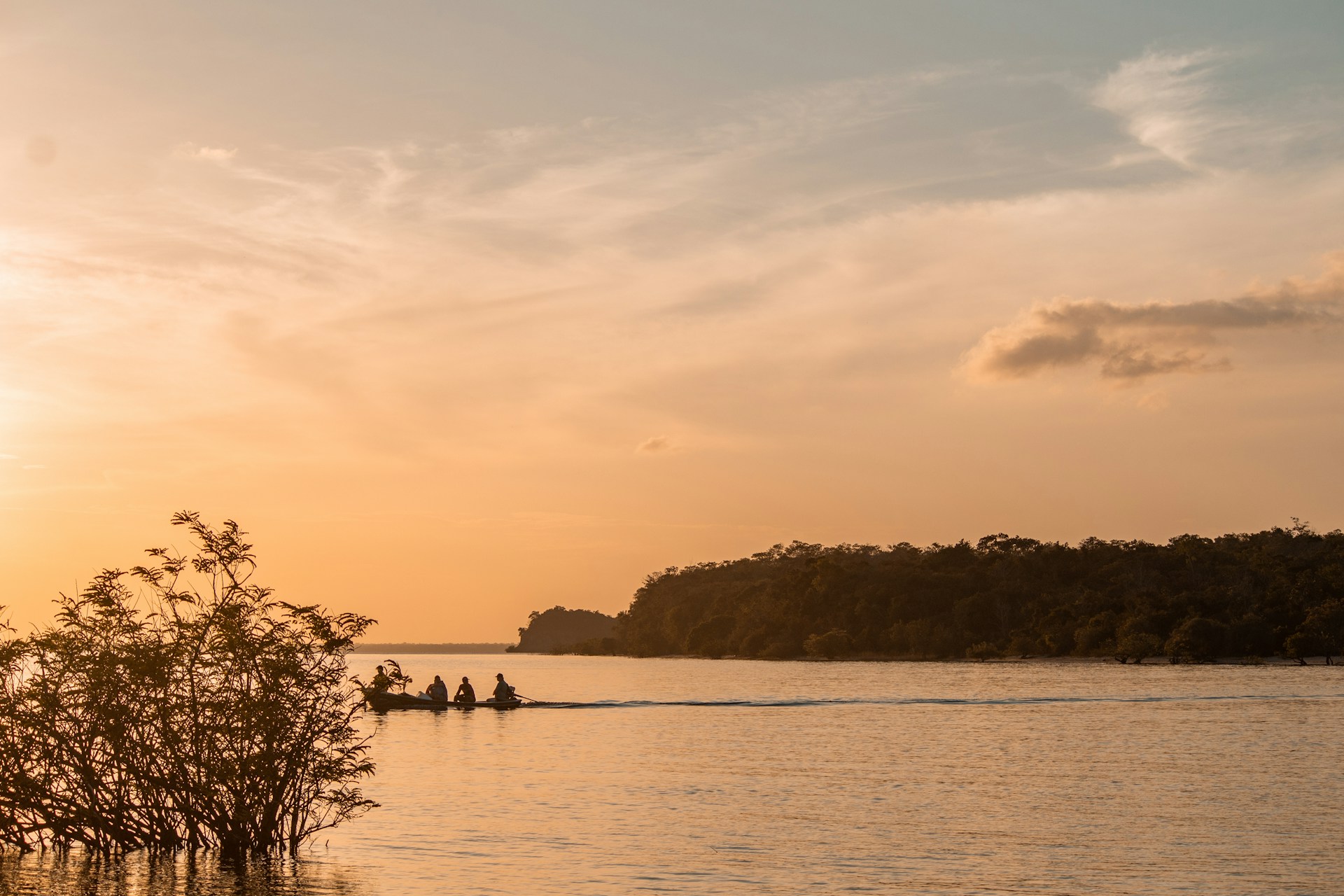 a group of people on a boat in the water