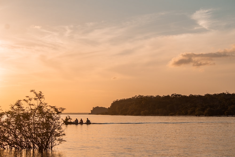 a group of people on a boat in the water