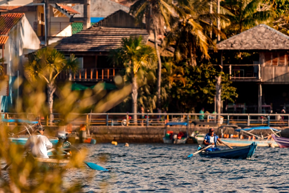 a group of boats floating on top of a body of water