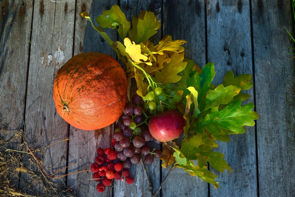 a close up of a fruit and vegetables on a wooden surface