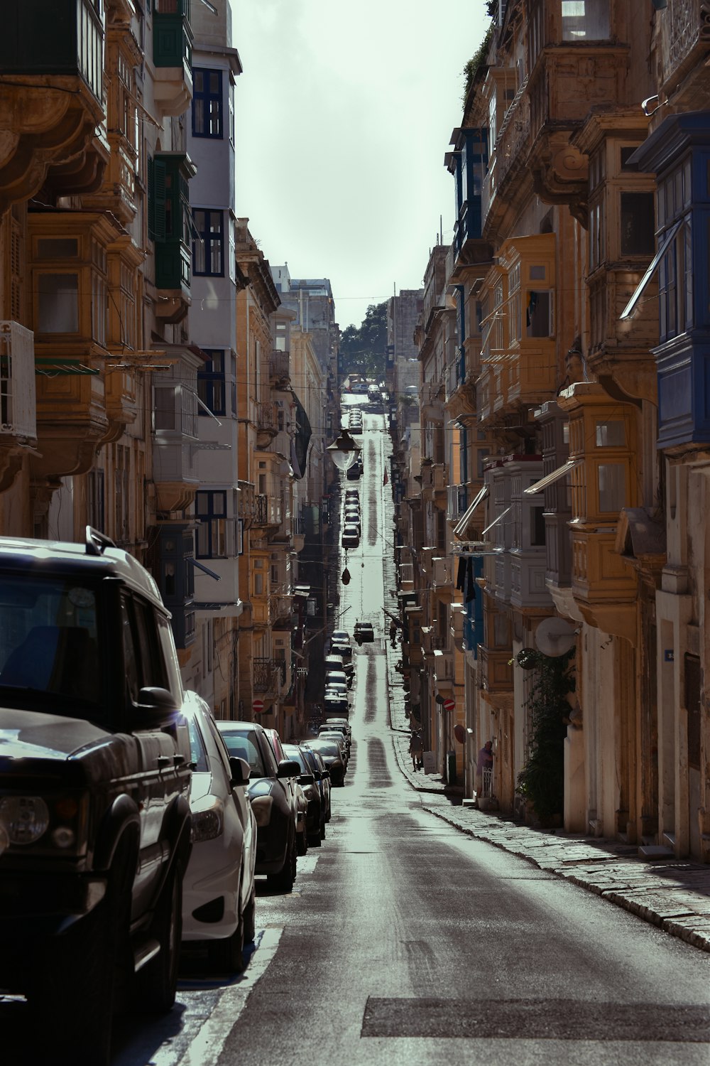 a street with cars parked on both sides of it