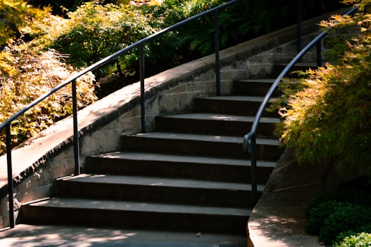 a man riding a skateboard down a set of stairs