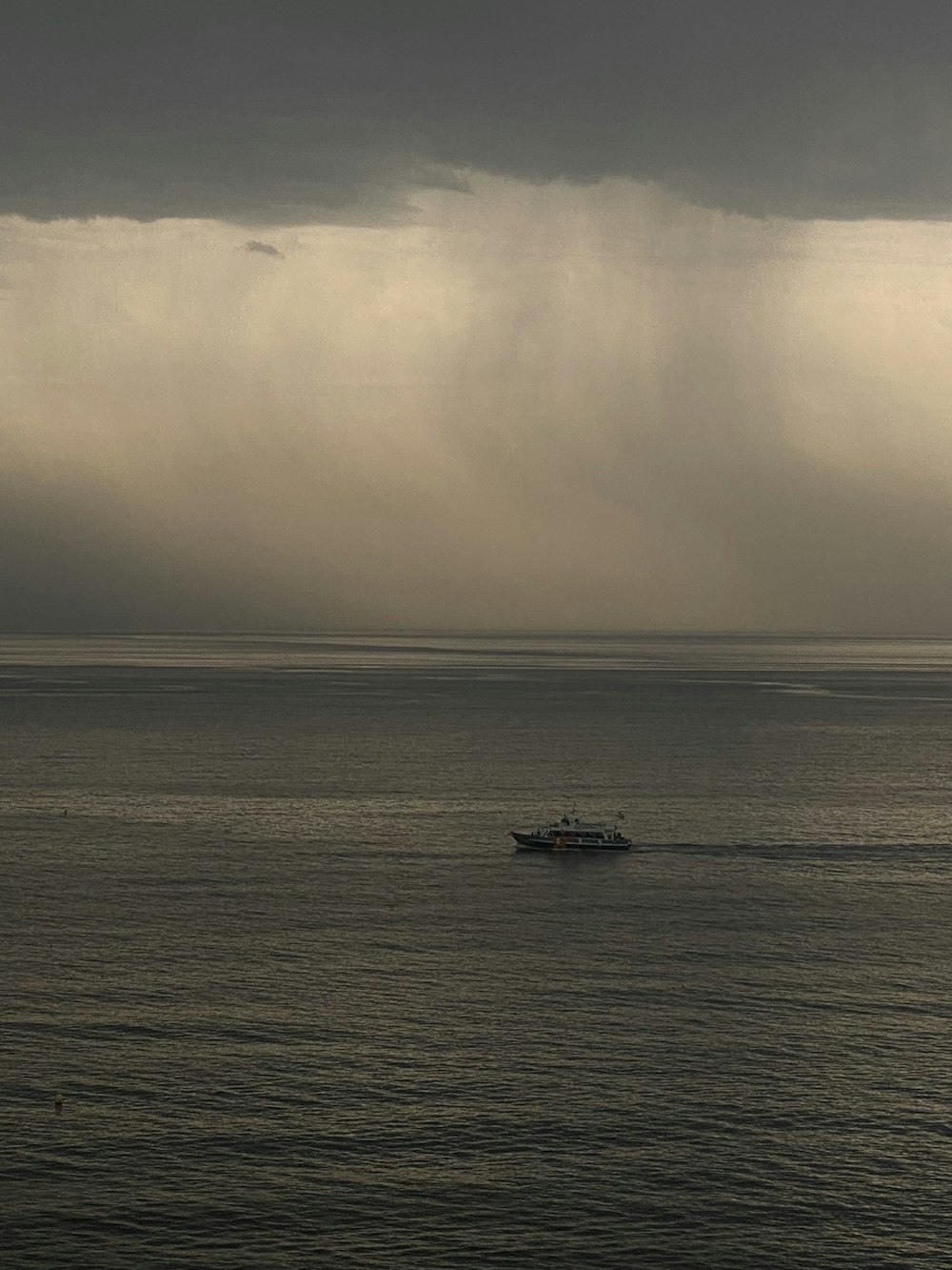 a boat in the middle of a large body of water