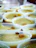Close-up of colorful liquid gelatin cups arranged neatly on a table.