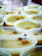 Close-up of colorful liquid gelatin cups arranged neatly on a table.
