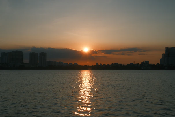 A calming sunset over a city skyline, evoking a sense of hope and renewal.
