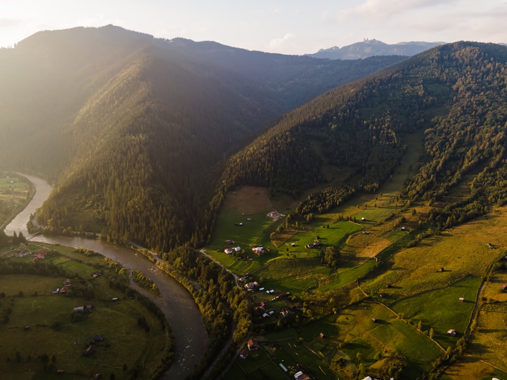 a river running through a lush green valley