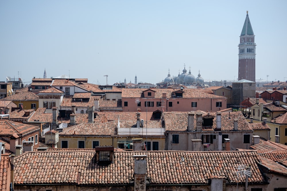 a view of a city with a clock tower in the background