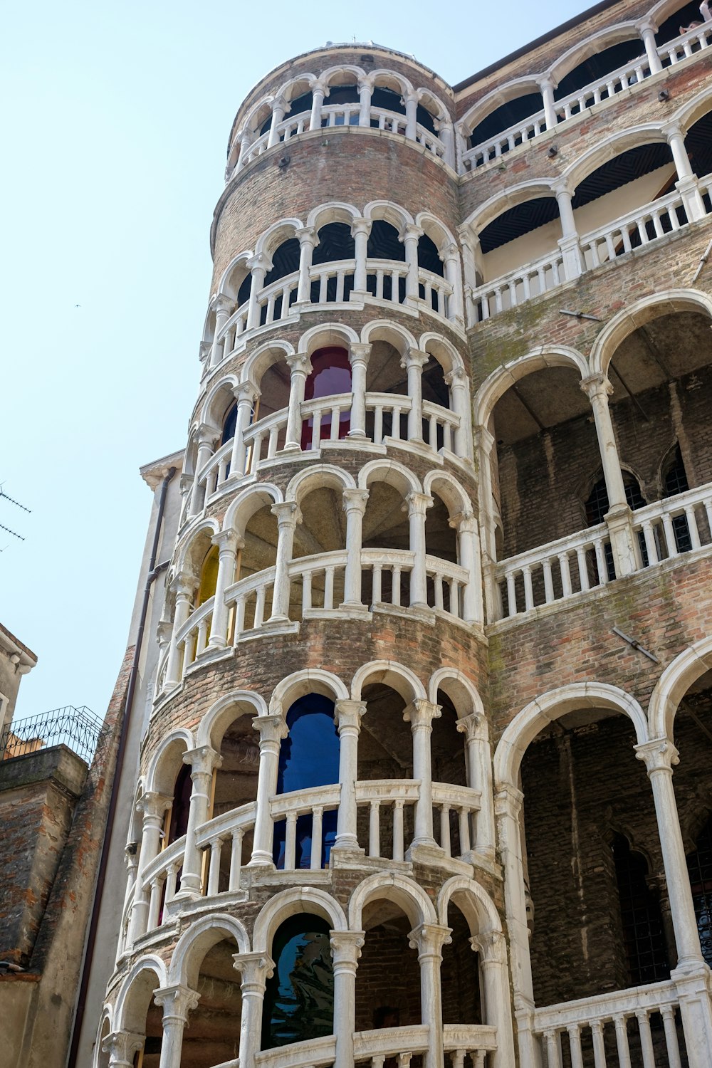 a very tall building with a bunch of balconies