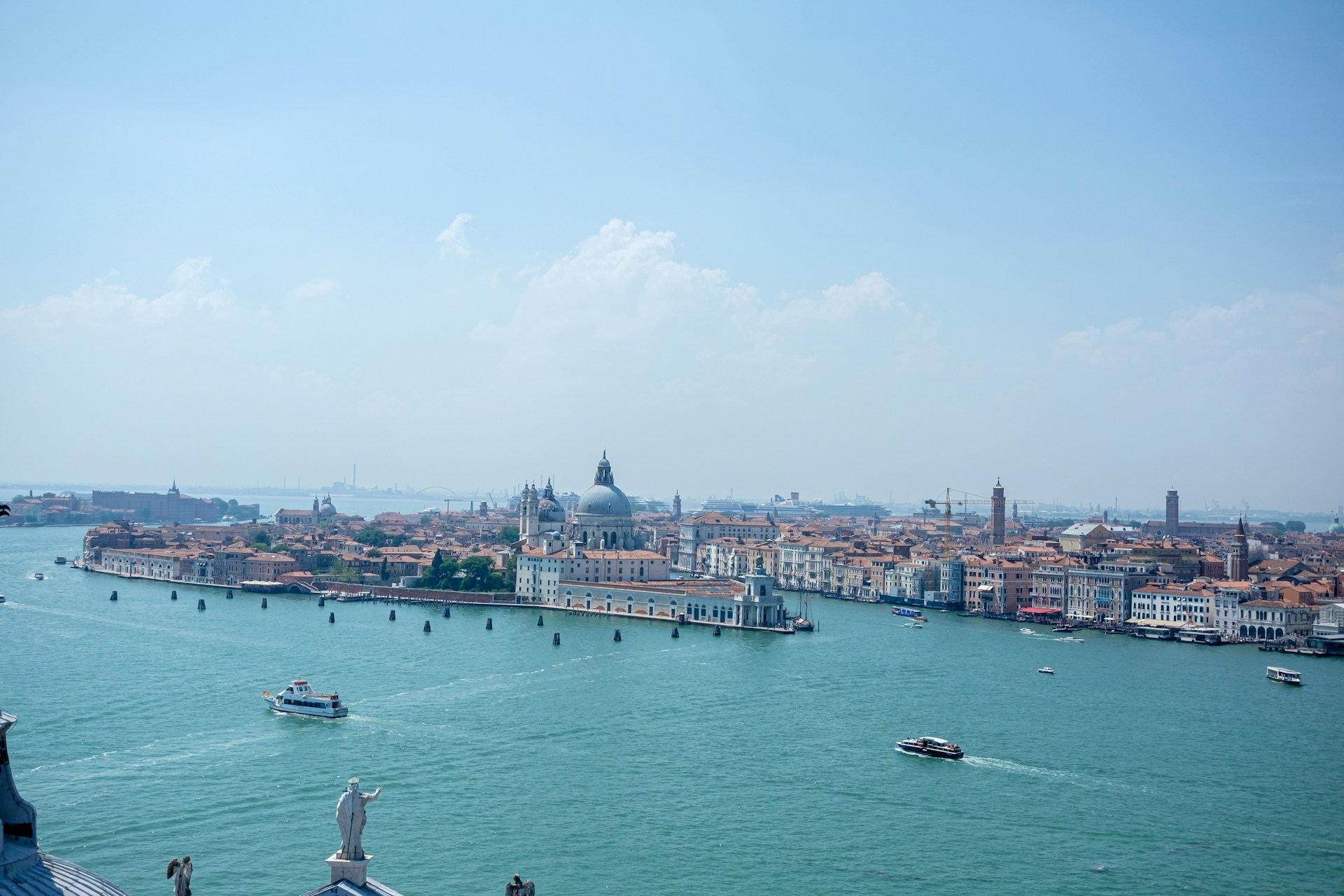 a large body of water with a city in the background