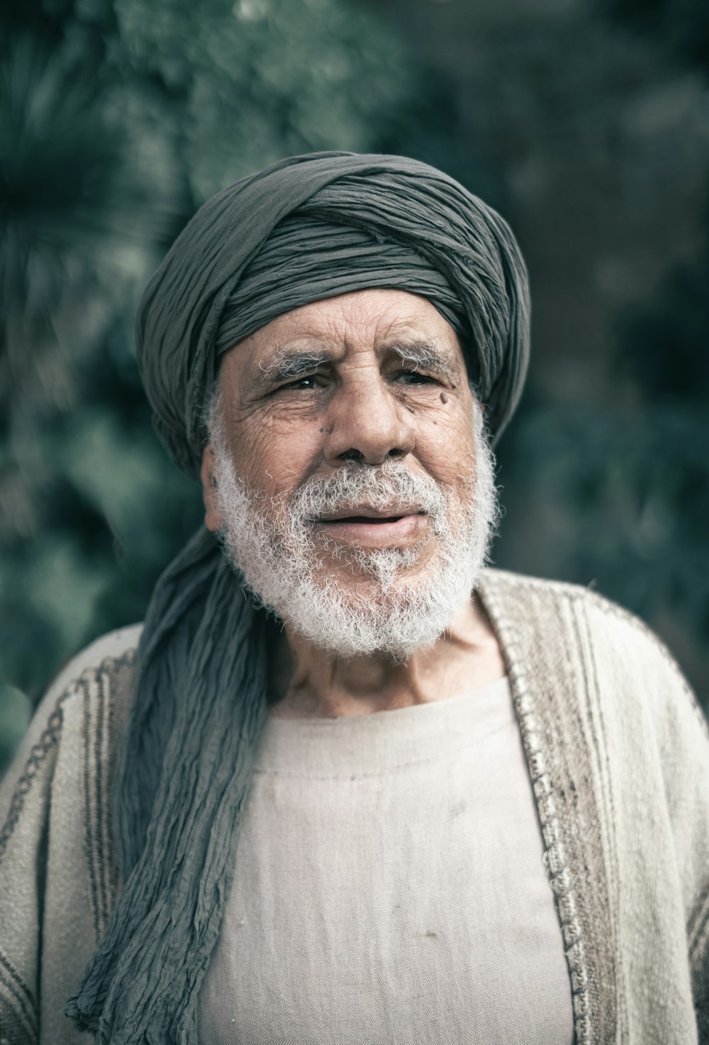 an old man with a turban on his head